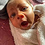 Amoura is registered to the contest to win money with this photo: baby, infant, face, expression, blanket, close_up, curious, surprised, eyes, mouth, skin, head, fur, texture, soft, light, shadow, pink, fabric, cozy