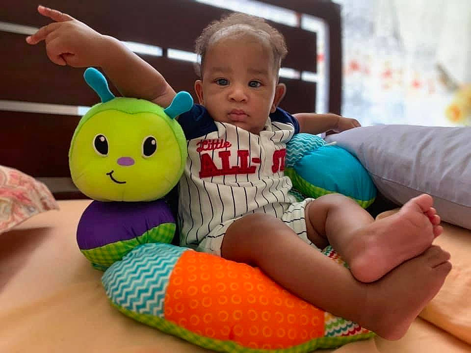 Deangelo joined the competition — help win amazing prizes! baby, baby_playing_with_toys, baby_toddler_clothing, child, comfort, eye, facial_expression, finger, fun, hand, happy, head, human, leg, leisure, mammal, person, product, skin, thigh