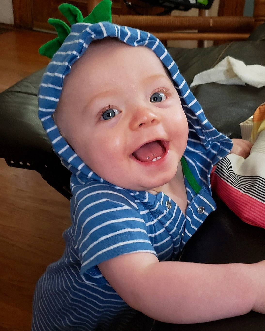 Beck is registered to the contest to win money with this photo: baby, baby_toddler_clothing, cheek, child, head, headgear, headwear, person, skin, smile, toddler