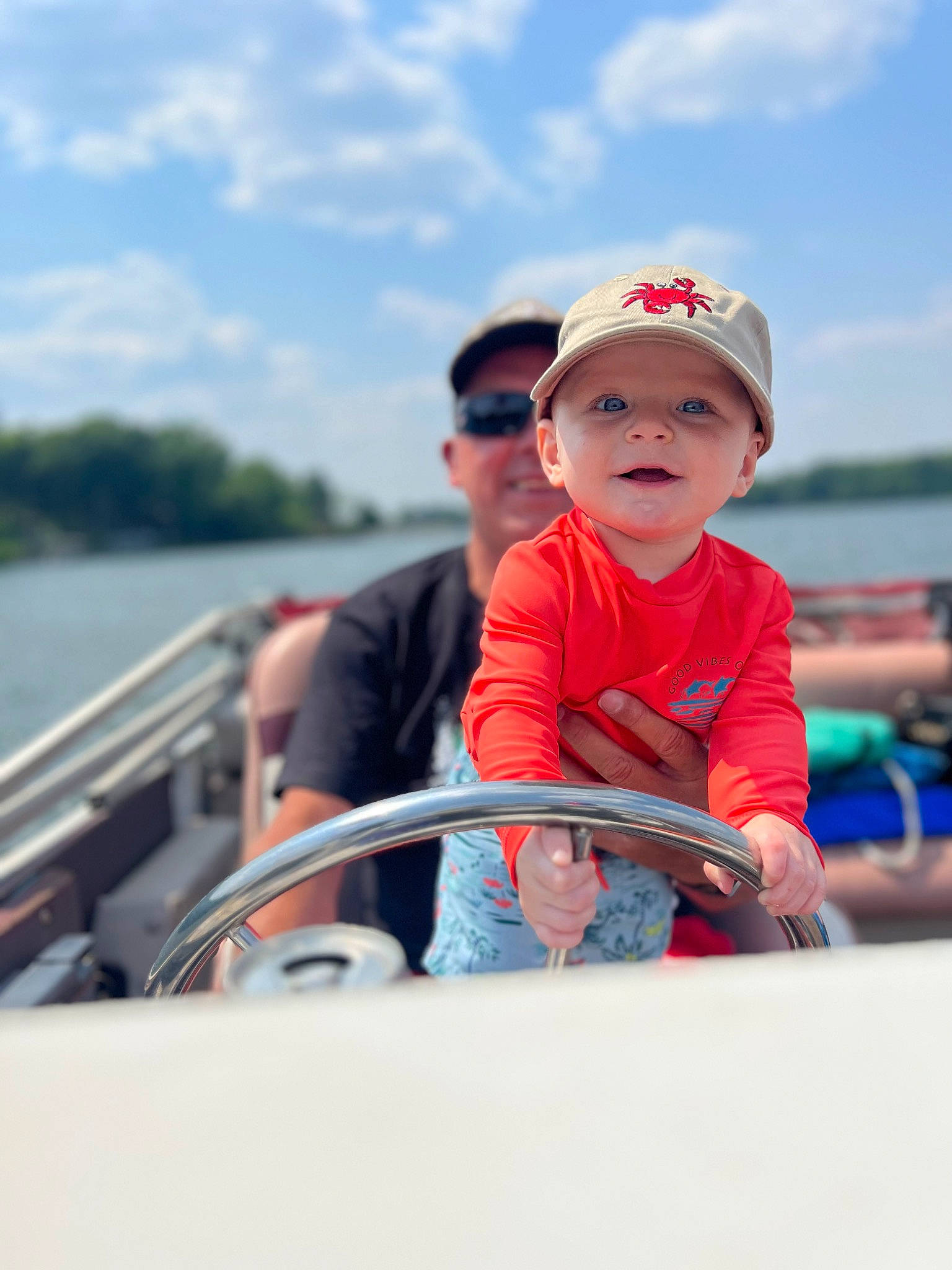 Remington joined the competition — help win amazing prizes! baby, baby_toddler_clothing, baseball_cap, boats_and_boating_equipment_and_supplies, cap, cloud, event, fun, happy, hat, headwear, lake, leisure, person, personal_protective_equipment, recreation, sitting, sky, t_shirt, toddler