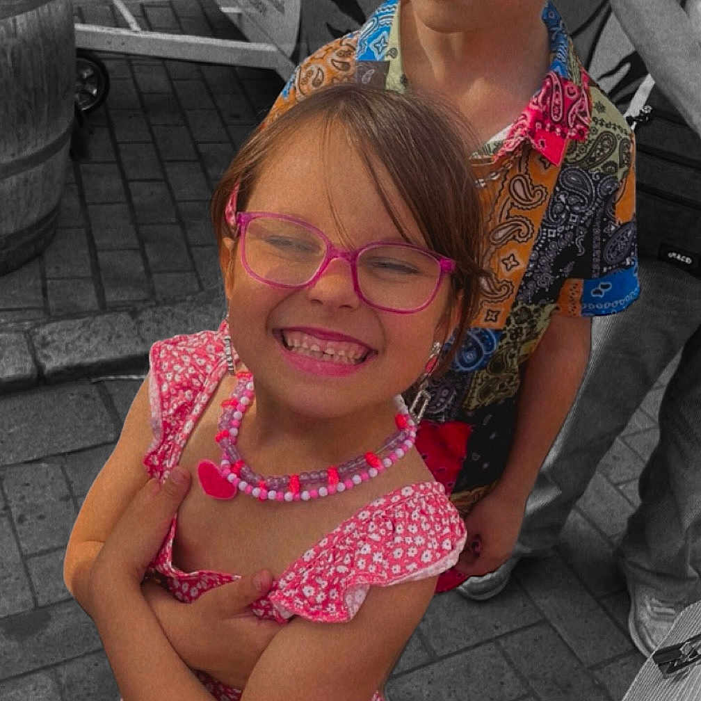 Lëana Martin participe au concours pour gagner de l'argent avec cette photo : accessories, blouse, child, city, clothing, dress, face, female, girl, happy, head, jewelry, necklace, person, photography, portrait, road, smile, street, urban