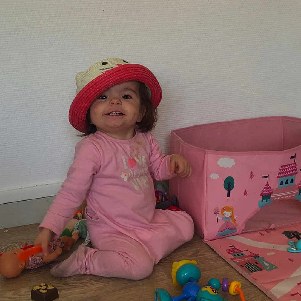 Lylou joined the competition — help win amazing prizes! baby, bodypart, cap, clothing, couch, face, finger, food, furniture, hand, hat, head, machine, person, photography, portrait, sweets, toy, wheel, wood