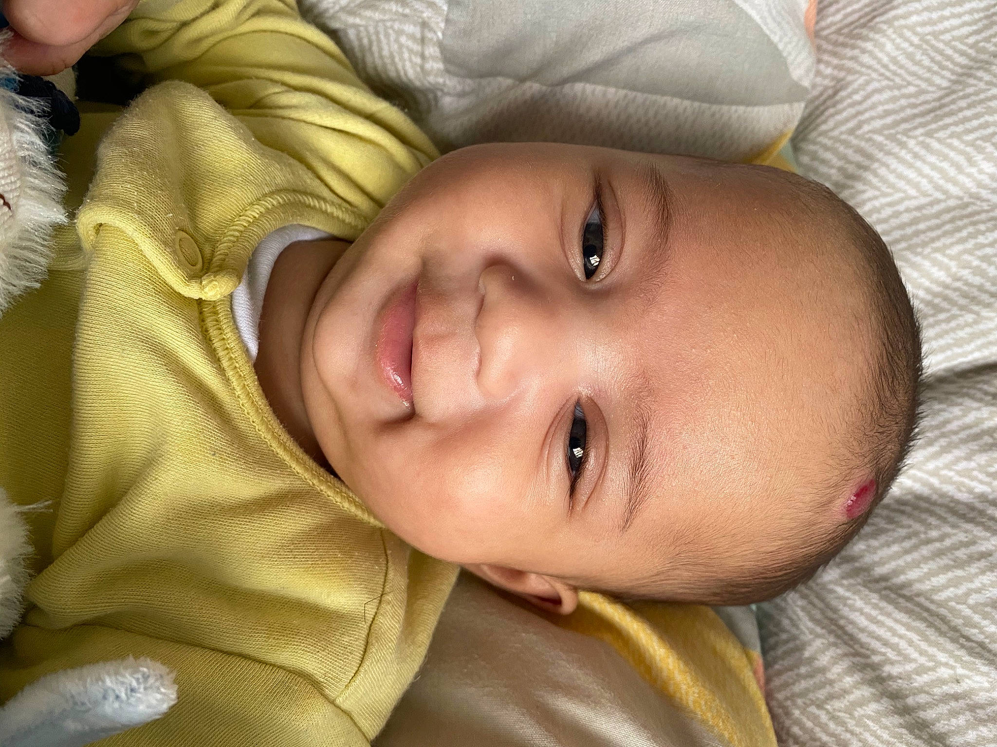 Aryan is registered to the contest to win money with this photo: baby, bedtime, cheek, child, chin, close_up, ear, eye, face, forehead, happy, head, lip, mouth, nose, person, portrait_photography, skin, smile, toddler