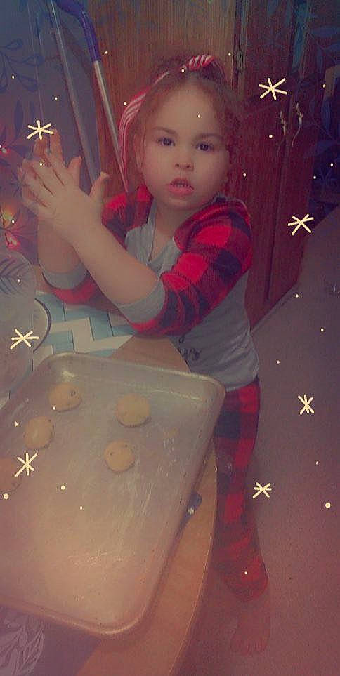 Meilani joined the competition — help win amazing prizes! carmine, child, christmas, christmas_decoration, christmas_eve, christmas_ornament, event, facial_expression, fun, happy, head, holiday, lighting, ornament, person, recreation, room, standing, thigh, toddler