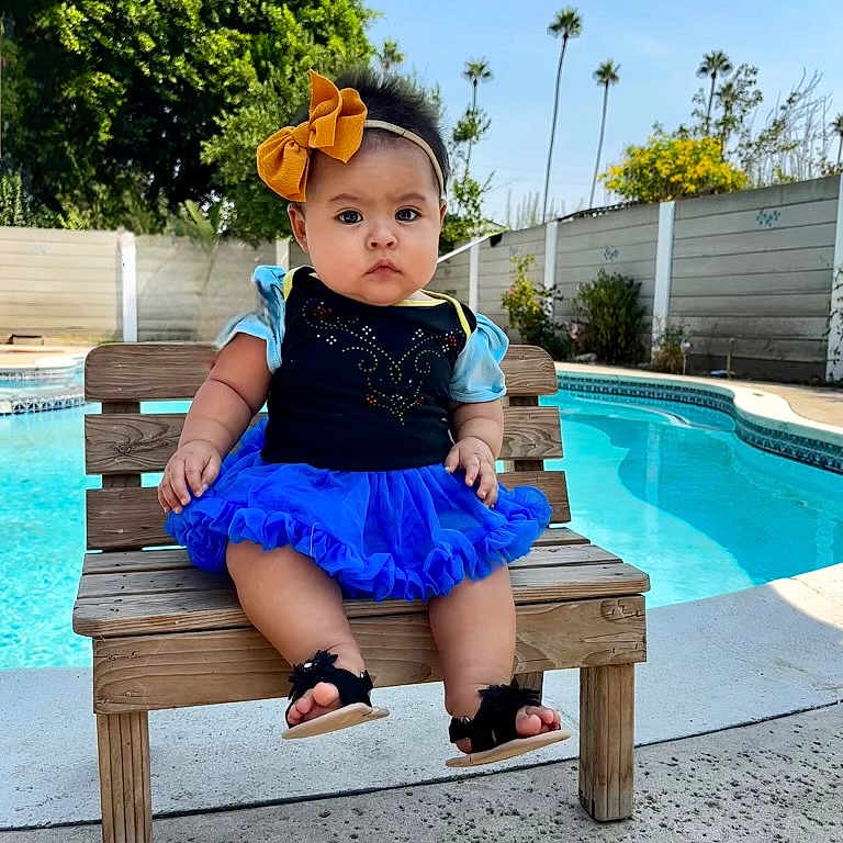 Salem is registered to the contest to win money with this photo: baby, backyard, clothing, face, footwear, furniture, head, nature, outdoors, person, photography, pool, portrait, sandal, sitting, sleeve, summer, swimmingpool, water, yard
