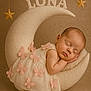 baby, sleeping, crescent_moon, soft_toys, dress, butterflies, newborn, portrait, studio, cute, peaceful, infant, decor, stars, resting, child, props, warm_lighting, soft_texture, background