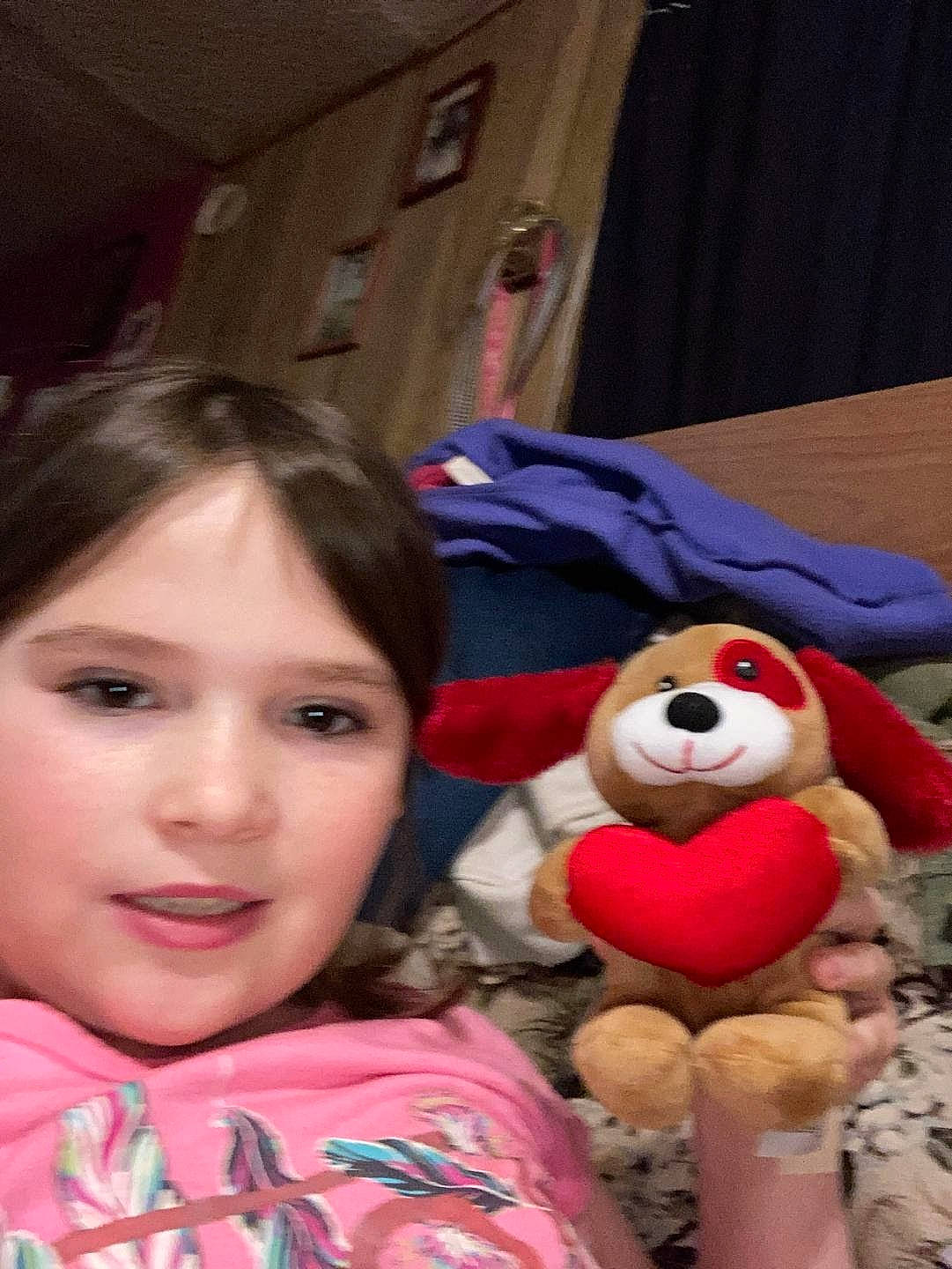 Sarah is registered to the contest to win money with this photo: bangs, cheek, child, curtain, eyelash, fun, fur, happy, leisure, mouth, nose, person, plush, portrait_photography, recreation, sitting, smile, stuffed_toy, textile, toy