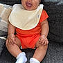 Zaylen joined the competition — help win amazing prizes! baby, smiling, orange_outfit, bib, white_socks, couch, happy, infant, portrait, cute, child, indoor, cozy, seated, person, skin, face, hand, footwear, expression