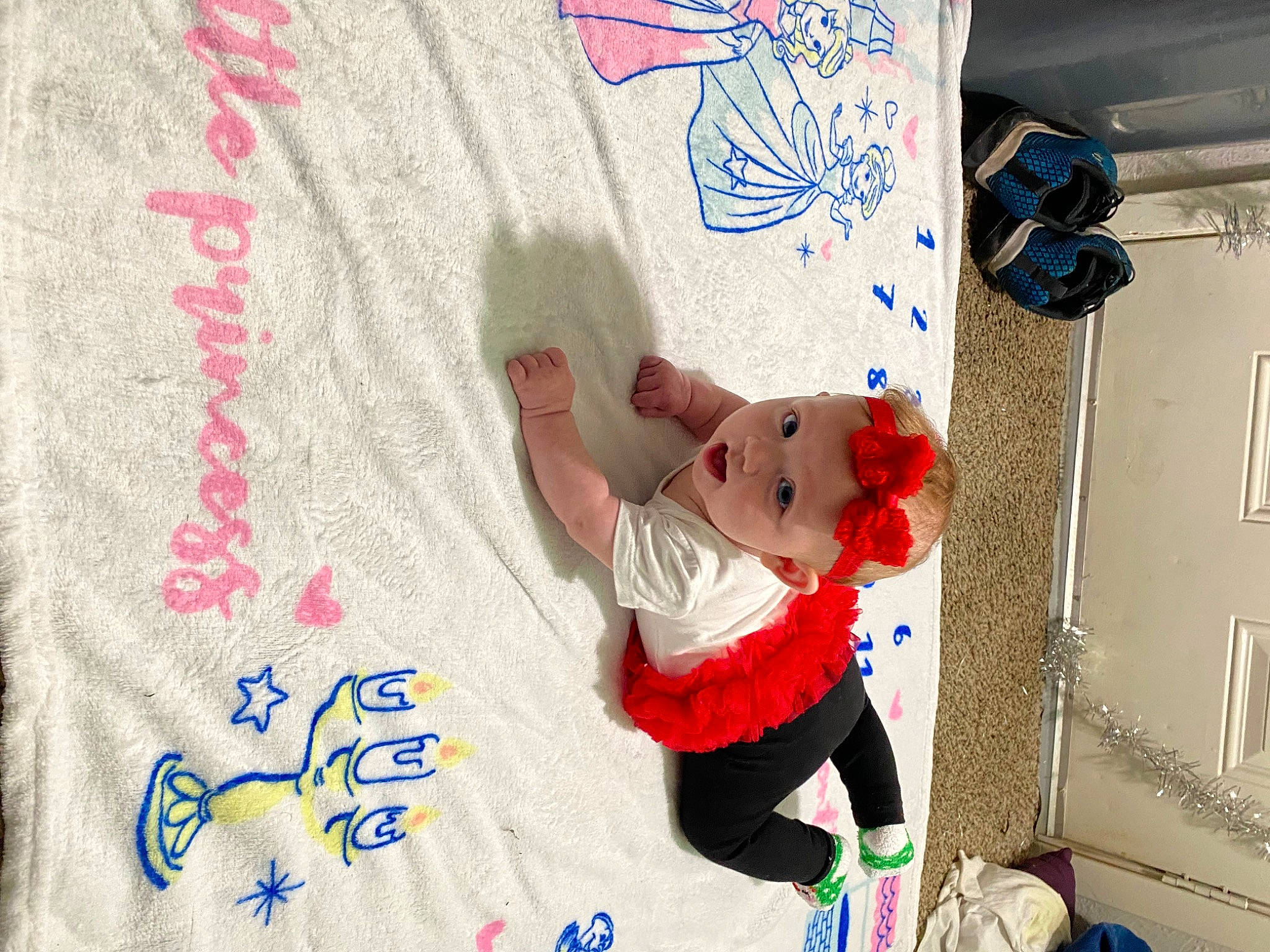 Jade is registered to the contest to win money with this photo: art, carmine, child, font, happy, headwear, linens, magenta, paper, pattern, person, play, room, sleeve, stuffed_toy, t_shirt, textile, toddler, visual_arts, world