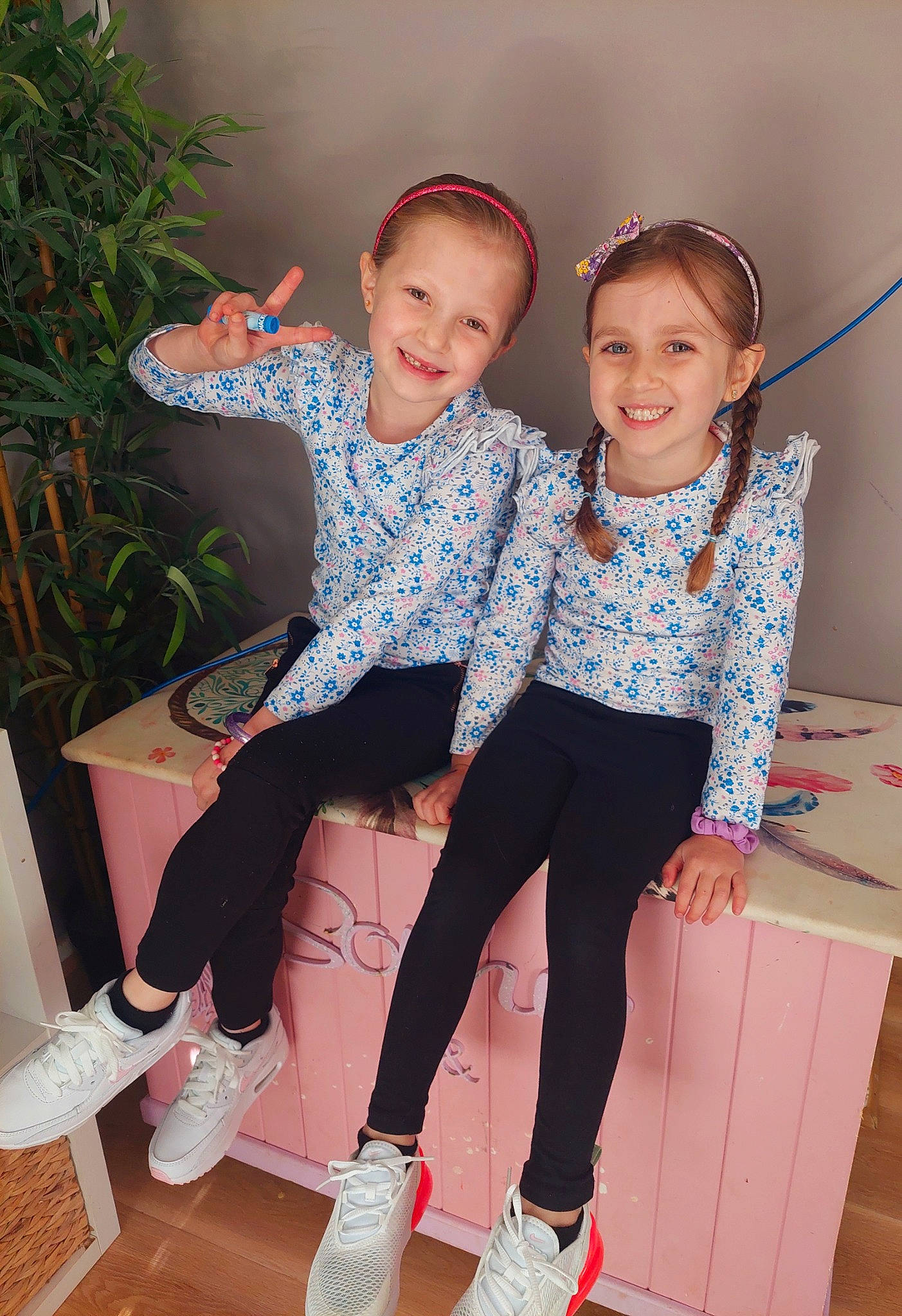 Sophie is registered to the contest to win money with this photo: baby_toddler_clothing, event, fashion_design, fun, gesture, happy, houseplant, joint, joy, leg, leisure, magenta, person, pink, plant, shoe, shoulder, smile, sock, thigh