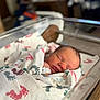 Celine joined the competition — help win amazing prizes! newborn, baby, sleeping, blanket, hospital, bassinet, footprint_pattern, infant, wrapped, peaceful, face, person, closeup, soft_light, indoors, healthcare, bed, rest, cute, toddler