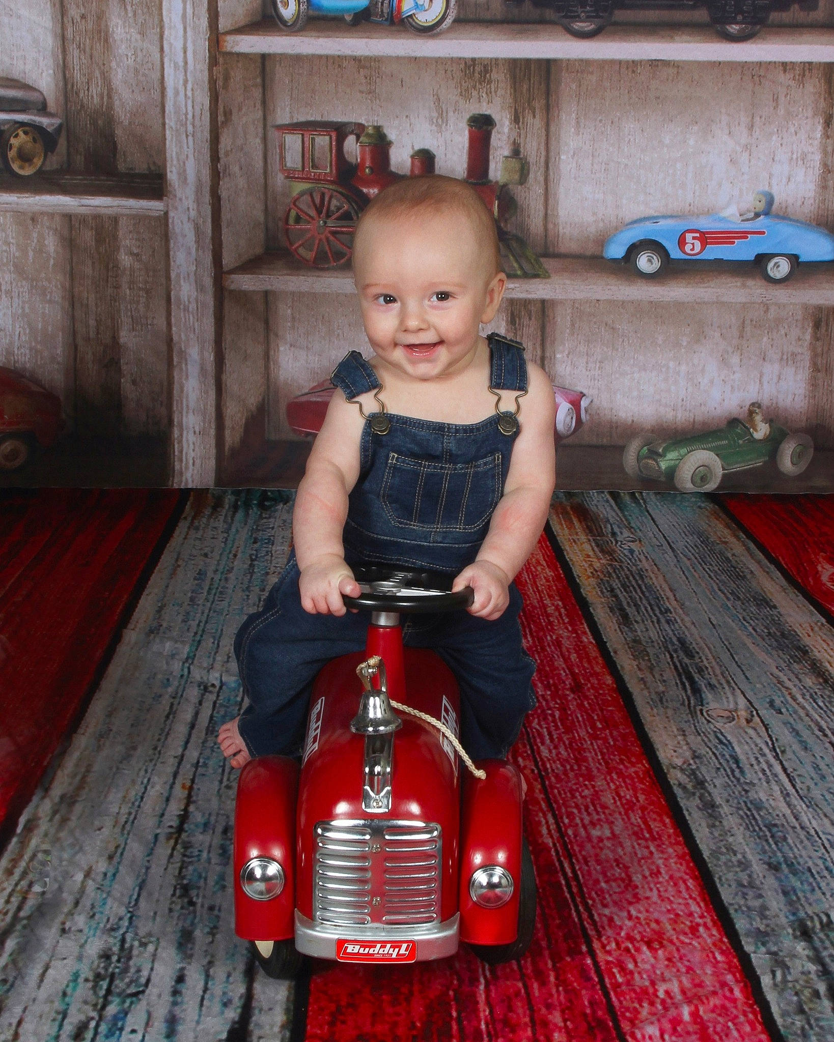Conor joined the competition — help win amazing prizes! car, child, classic, joy, person, play, red, sitting, smile, toddler, toy, toy_vehicle, vacation, vehicle, wood