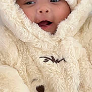 Harriet Marie joined the competition — help win amazing prizes! baby, child, face, hat, knit_hat, snowsuit, fur, plush, warm_clothing, cute, smiling, outdoor_clothing, winter_wear, infant, portrait, closeup, expression, soft_texture, wrapped_up, adorable