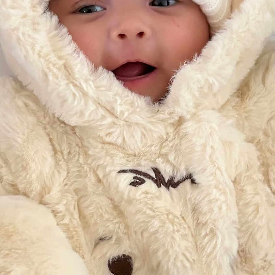 Harriet Marie joined the competition — help win amazing prizes! adorable, baby, child, closeup, cute, expression, face, fur, hat, infant, knit_hat, outdoor_clothing, plush, portrait, smiling, snowsuit, soft_texture, warm_clothing, winter_wear, wrapped_up