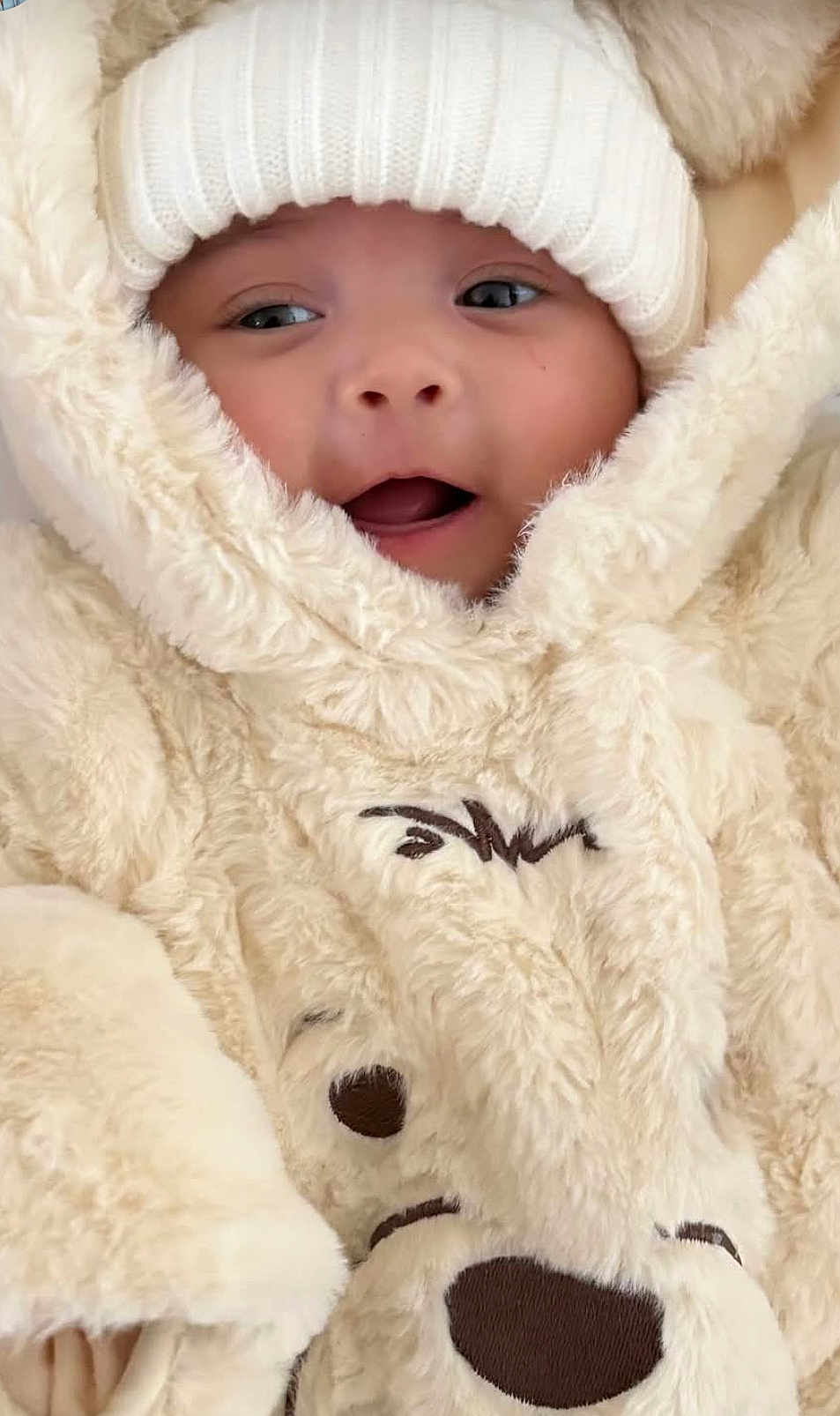 Harriet Marie joined the competition — help win amazing prizes! baby, child, face, hat, knit_hat, snowsuit, fur, plush, warm_clothing, cute, smiling, outdoor_clothing, winter_wear, infant, portrait, closeup, expression, soft_texture, wrapped_up, adorable