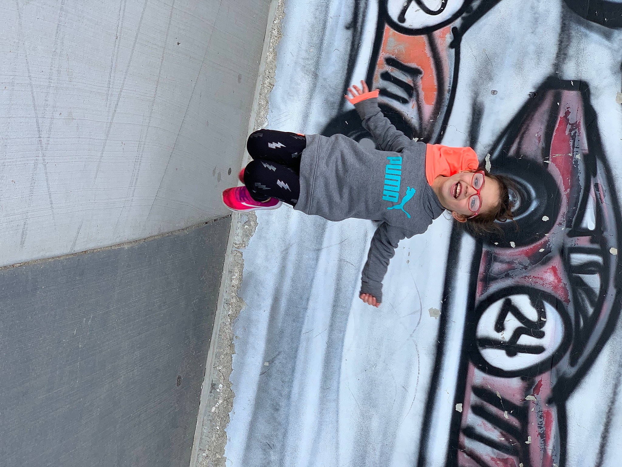 Selena joined the competition — help win amazing prizes! art, asphalt, carmine, concrete, eyewear, fictional_character, graffiti, grey, mural, person, personal_protective_equipment, recreation, sidewalk, street, street_art, street_fashion, toddler, tree, visual_arts, window