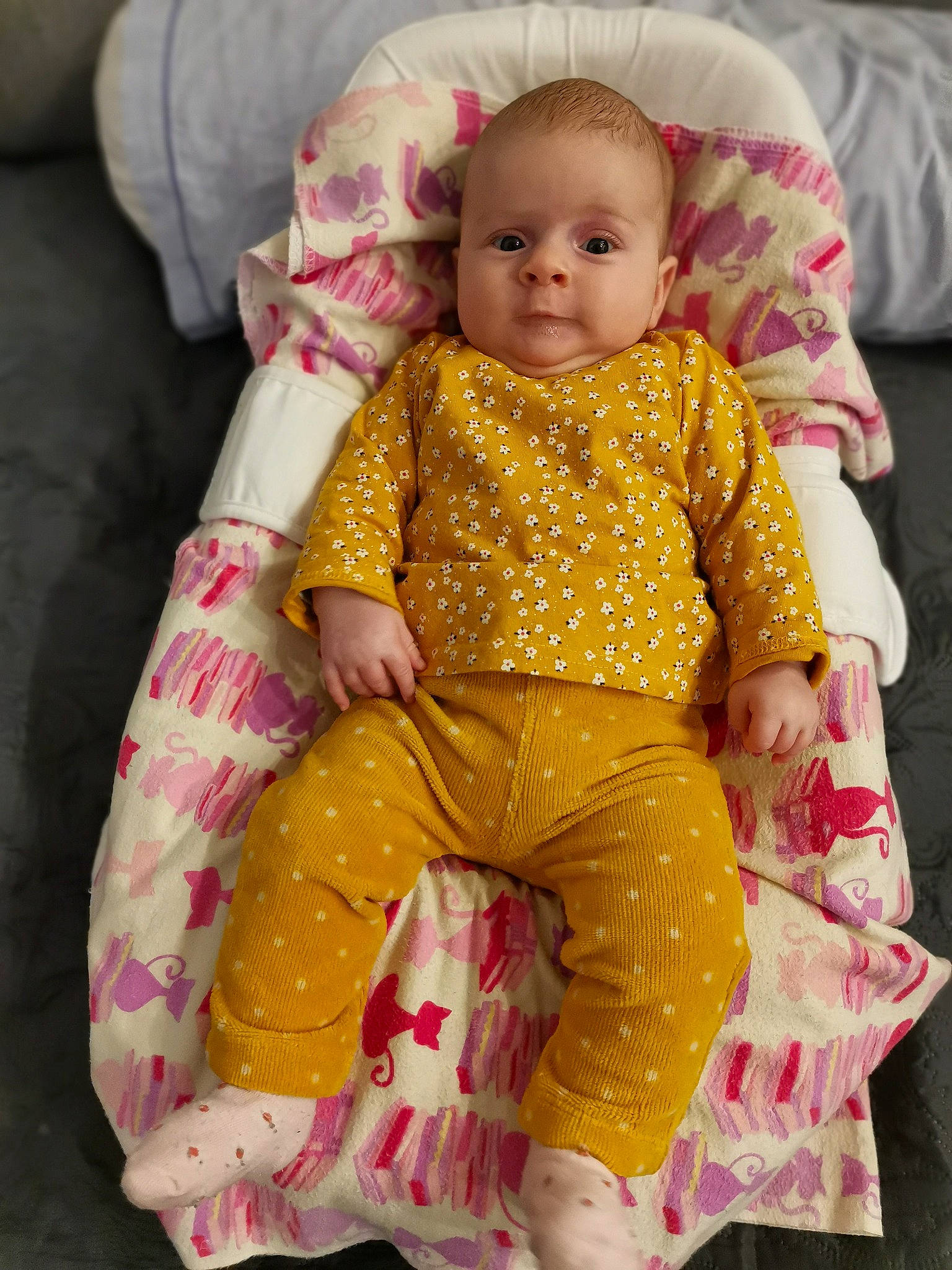 Sofiia a rejoint le concours — aidez-le/la à gagner de superbes lots ! arm, baby, baby_products, baby_toddler_clothing, baby_toys, cheek, child, comfort, dress, facial_expression, iris, linens, magenta, pattern, person, pink, sitting, skin, sleeve, textile