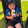 Kobi joined the competition — help win amazing prizes! black_shorts, blue_shirt, bucket_hat, child, face, food, fun, grass, happy, hat, ice_cream, melting_ice_cream, outdoor, playful, smiling, sneakers, stroller, summer, sunlight, toddler