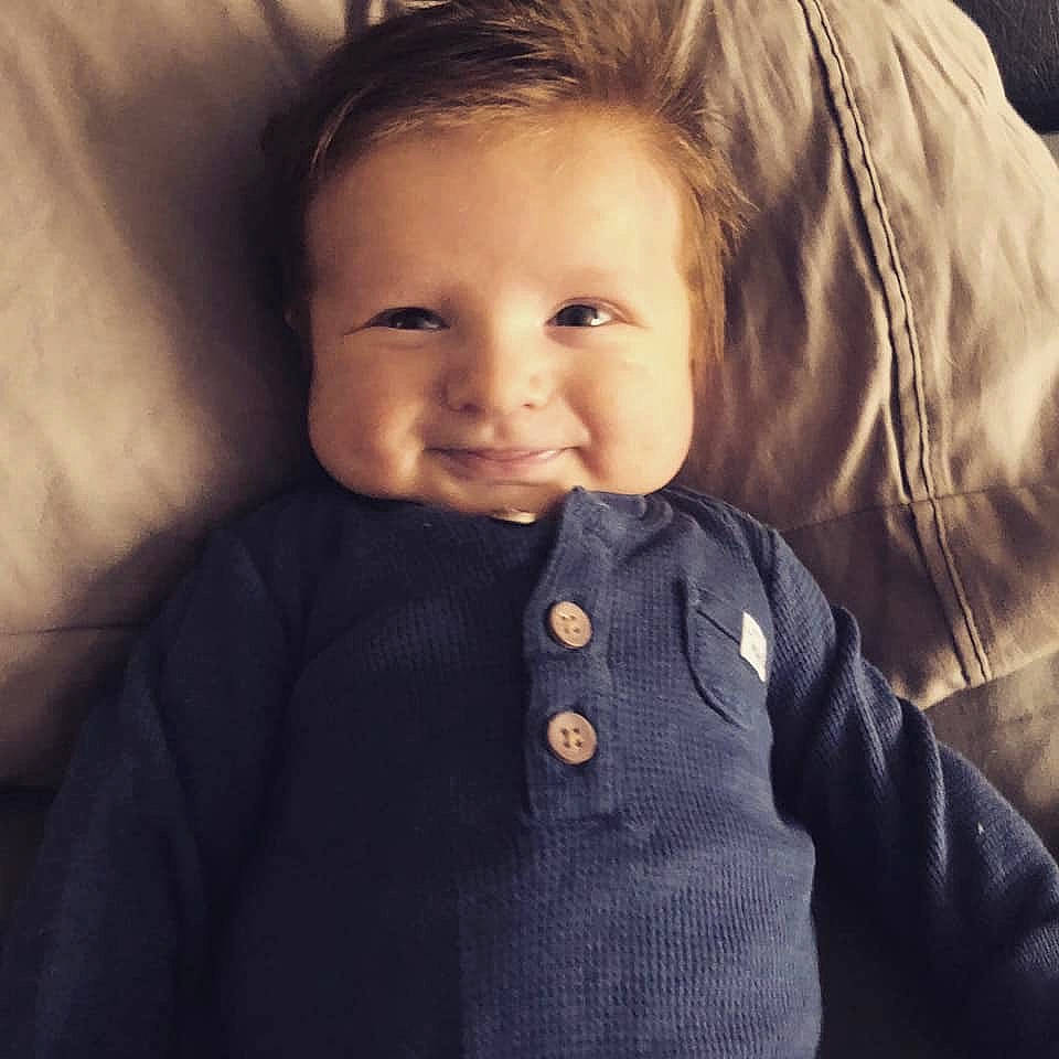 Greyson is registered to the contest to win money with this photo: baby, beauty, cheek, child, chin, cool, eye, face, forehead, hair, hairstyle, head, human, iris, lip, nose, outerwear, person, skin, smile