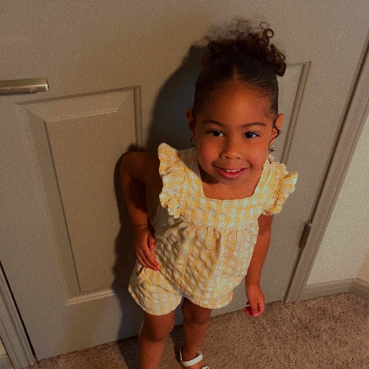Angelina joined the competition — help win amazing prizes! butterfly, carpet, casual, child, clothing, curly_hair, door, footwear, girl, hair_tied, happy, indoor, person, pose, sandals, skin_tone, smile, standing, yellow_outfit, young_child