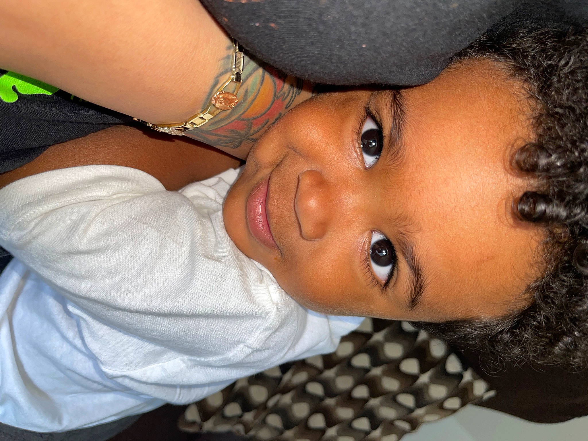 Kobe is registered to the contest to win money with this photo: black_hair, cheek, chest, child, elbow, eyelash, face, forehead, fun, gesture, happy, hat, iris, lip, mouth, neck, nose, person, skin, smile