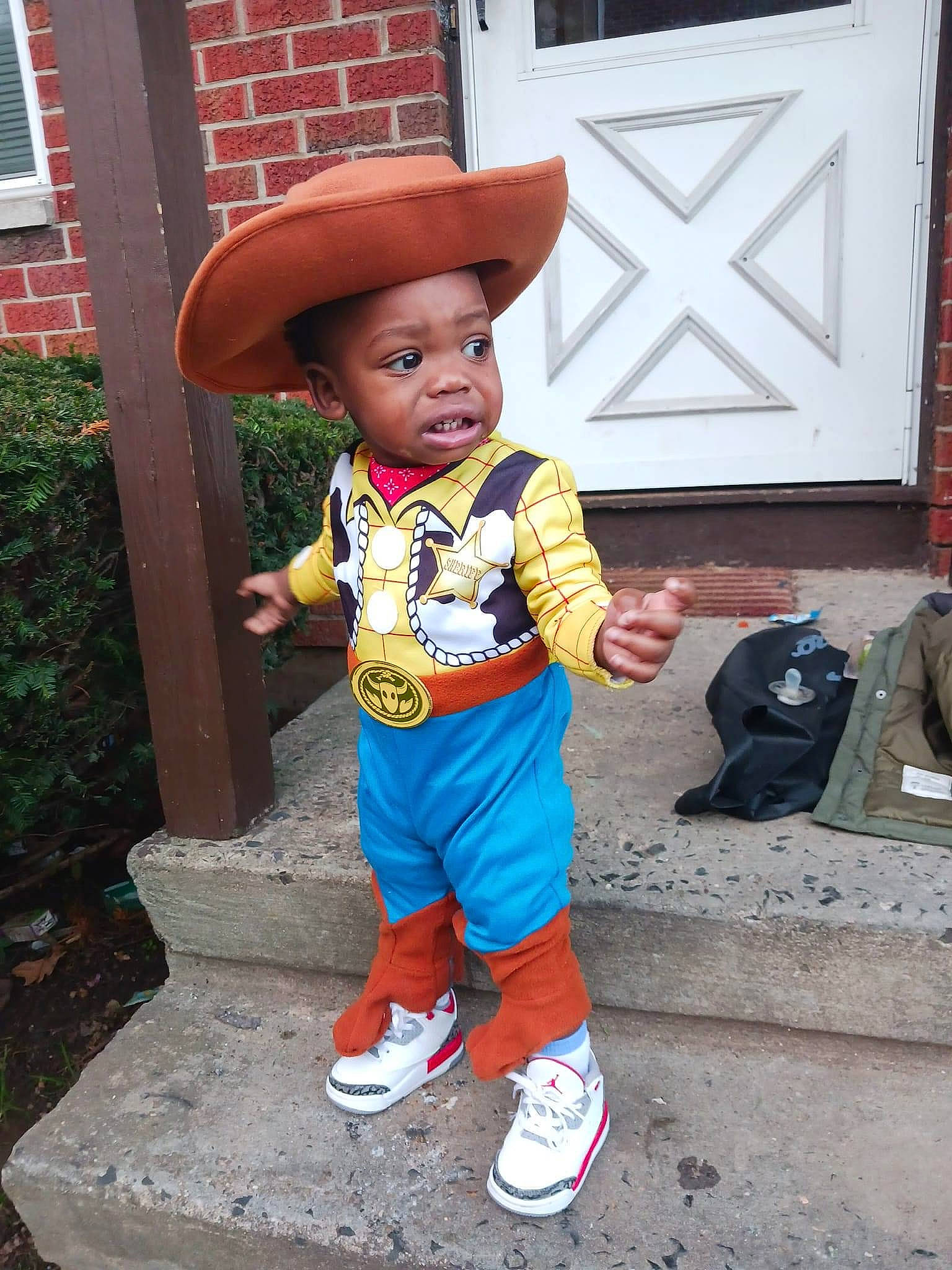 Eli joined the competition — help win amazing prizes! art, baby, backpack, bag, cap, child, costume, costume_hat, door, fashion_accessory, fictional_character, hat, lawn_ornament, leisure, luggage_and_bags, magenta, person, plant, sun_hat, toddler