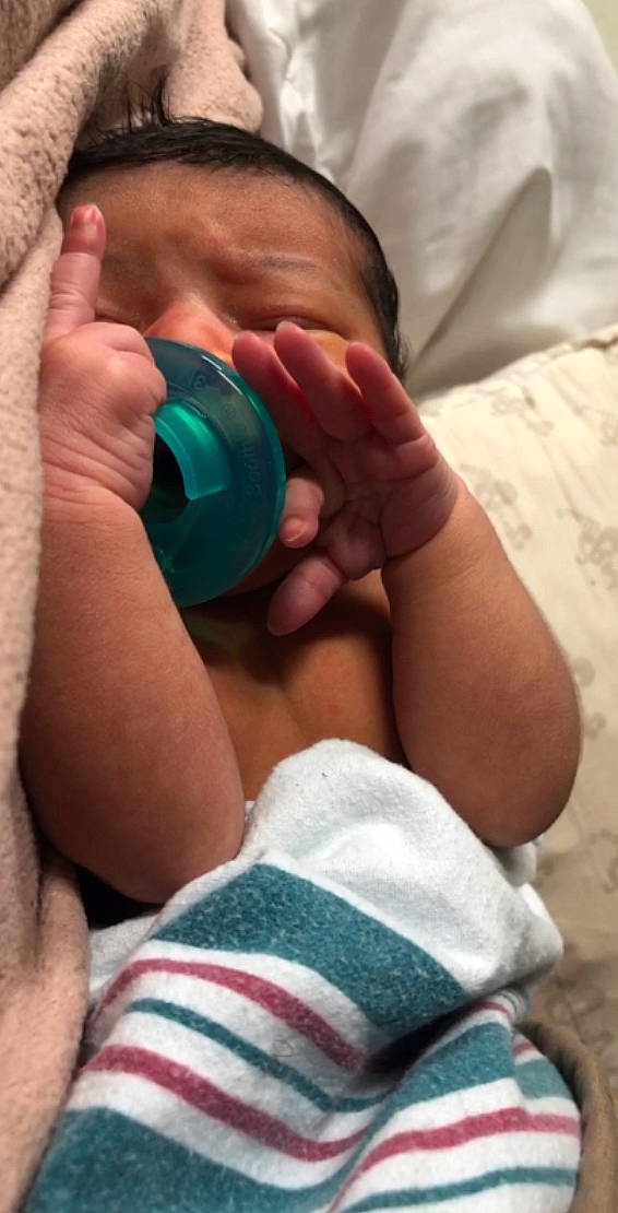Kairo is registered to the contest to win money with this photo: azure, baby, chest, comfort, drinkware, elbow, finger, gadget, gesture, hand, joint, mouth, nail, nose, person, skin, thigh, thumb, toddler, trunk