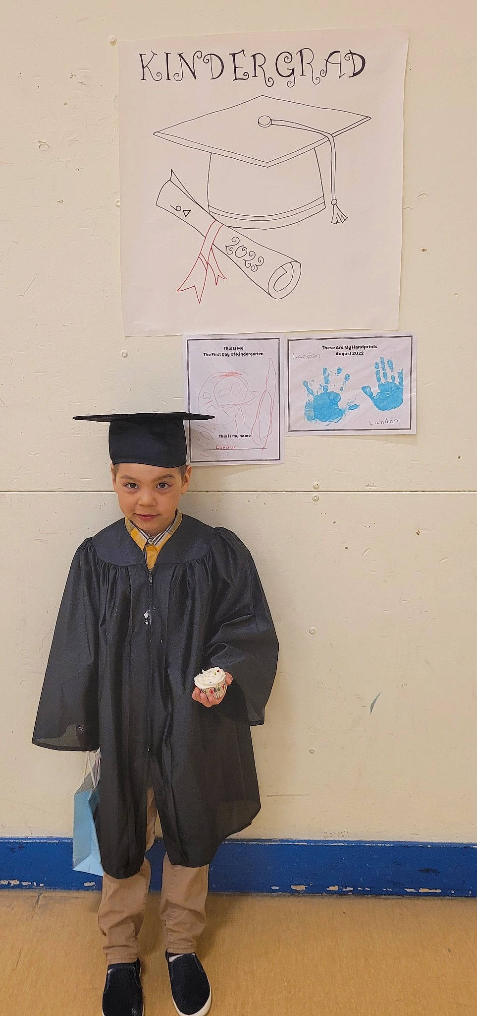 Landon is registered to the contest to win money with this photo: academic_dress, academic_institution, art, drawing, electric_blue, event, fashion_design, formal_wear, fun, gesture, graduation, hat, headgear, headwear, mortarboard, person, phd, public_event, room, scholar