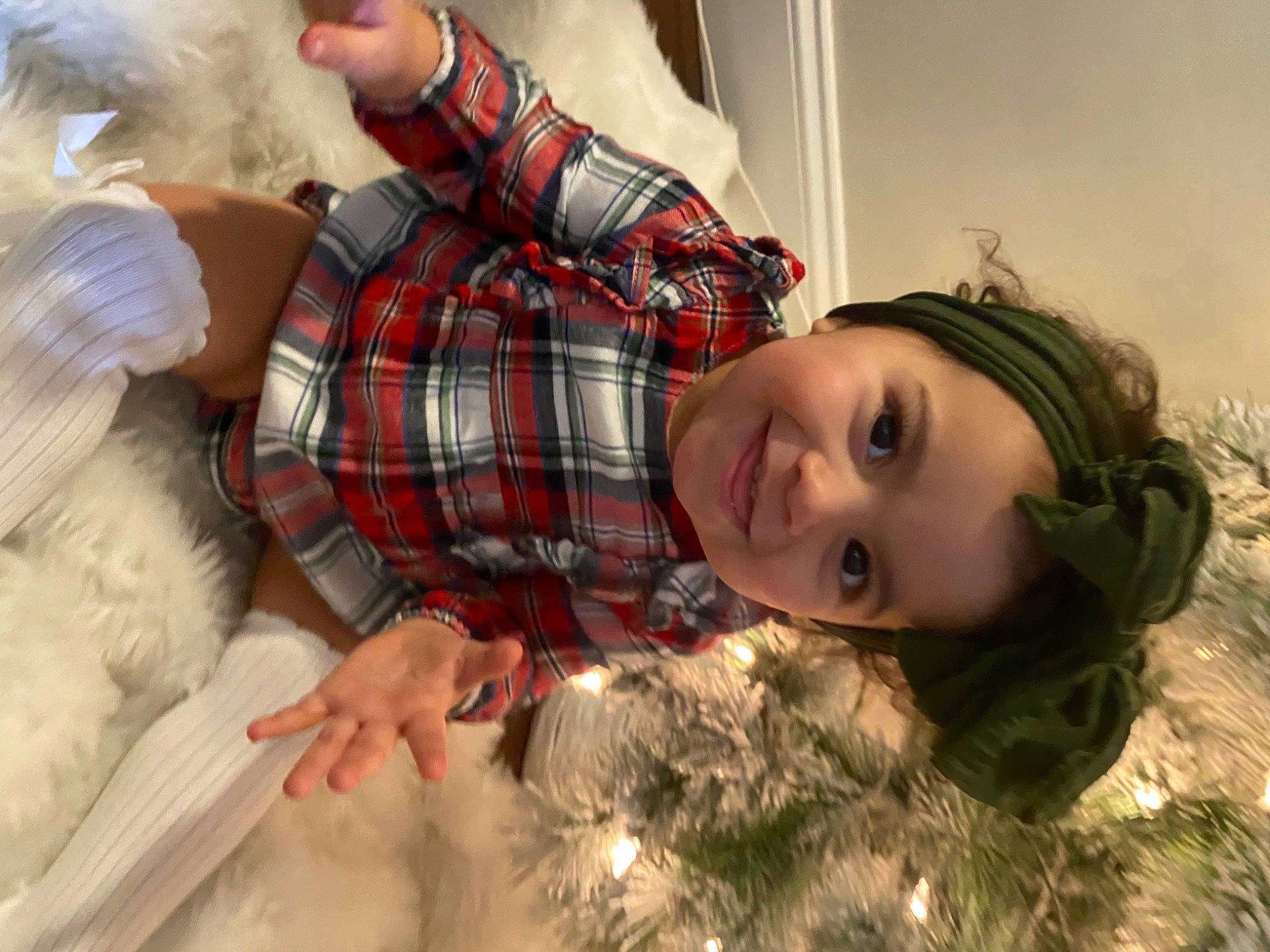 Olivia is registered to the contest to win money with this photo: brown_hair, christmas, christmas_ornament, dress, event, eye, fun, fur, grass, happy, human_body, human_leg, joy, long_hair, ornament, pattern, person, plaid, plant, smile