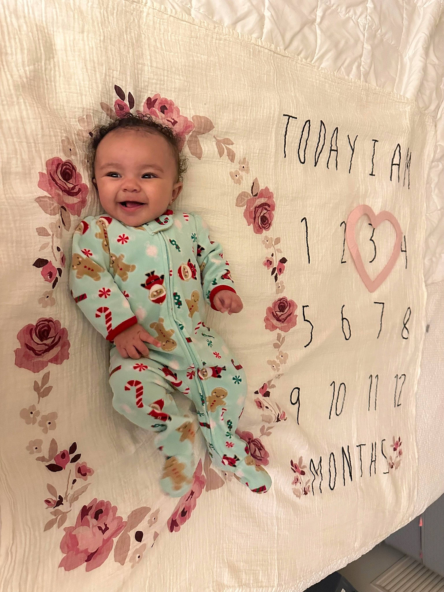 Emersyn is registered to the contest to win money with this photo: baby_toddler_clothing, child, design, embellishment, event, flower, font, handwriting, happy, joy, magenta, paper, pattern, peach, person, petal, pink, rectangle, sleeve, smile
