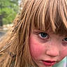 Presley is registered to the contest to win money with this photo: child, close_up, face, blue_eyes, blond_hair, dirty_face, outdoor, nature, cheeks, messy_hair, portrait, young_child, skin, expression, casual_clothing, curious, playful, natural_light, red_cheeks, grass