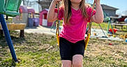 Presley joined the competition — help win amazing prizes! activity, casual_clothing, child, daylight, fun, girl, grass, happy, outdoor, park, person, play_equipment, playground, recreation, smiling, summer, sunny, swing, trees, young