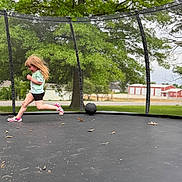 Presley joined the competition — help win amazing prizes! child, running, trampoline, outdoor, netting, ball, grass, tree, greenery, play, active, sport, casual_clothing, shorts, tshirt, shoes, daylight, nature, fun, young