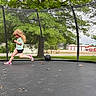 Presley joined the competition — help win amazing prizes! child, running, trampoline, outdoor, netting, ball, grass, tree, greenery, play, active, sport, casual_clothing, shorts, tshirt, shoes, daylight, nature, fun, young