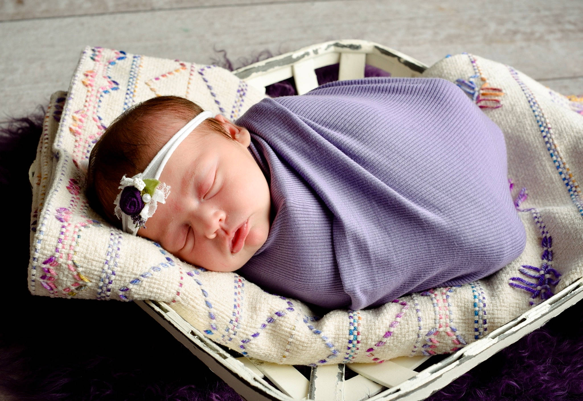 Rainie is registered to the contest to win money with this photo: baby, baby_products, baby_toddler_clothing, child, comfort, couch, grass, headgear, linens, mammal, pattern, person, pink, plaid, product, purple, skin, sleeve, textile, toddler