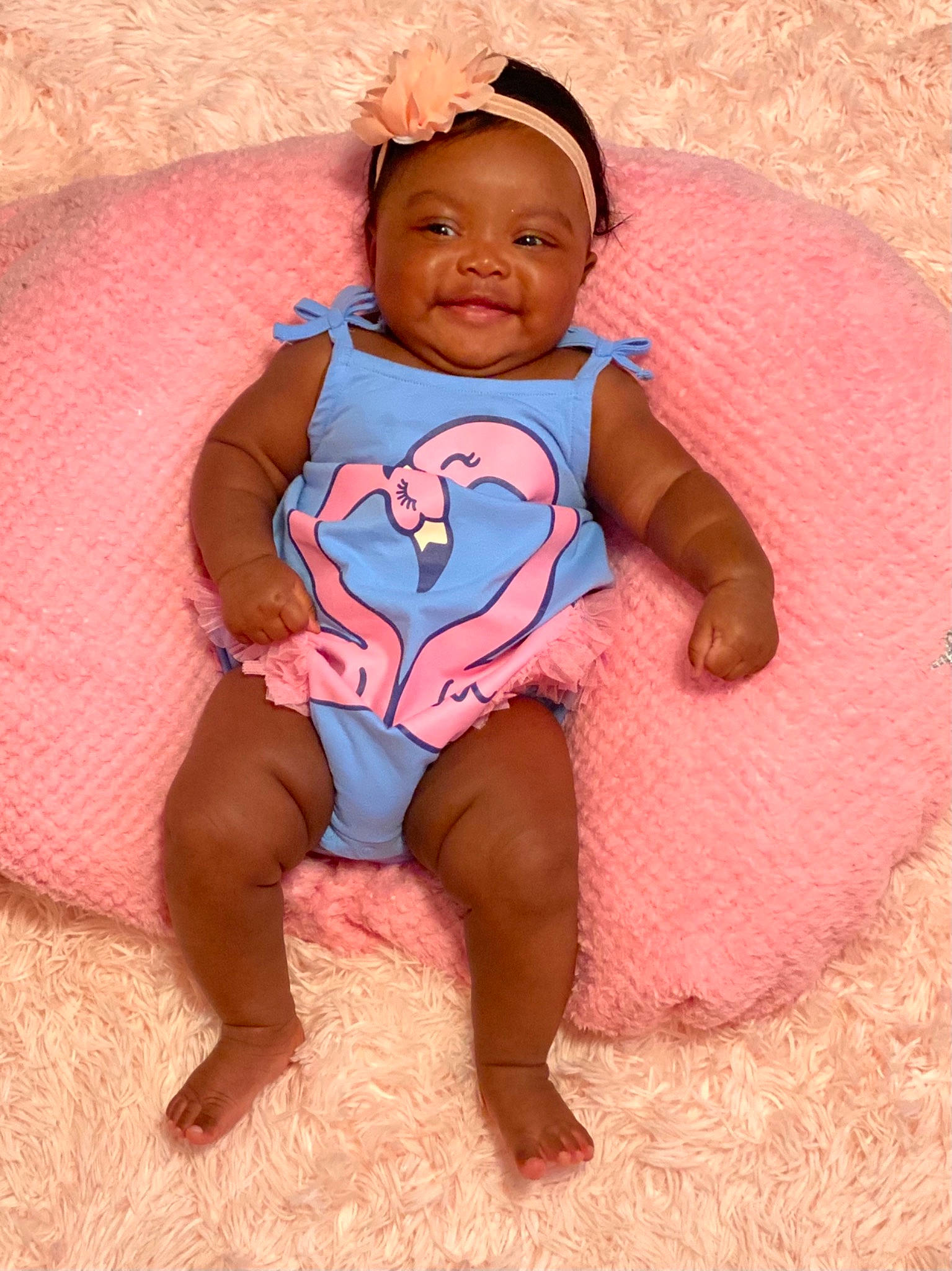 Jubilee is registered to the contest to win money with this photo: baby_toddler_clothing, barefoot, child, eye, finger, hair, happy, headgear, human_body, joy, leg, mammal, mouth, neck, person, pink, skin, sleeve, smile, t_shirt