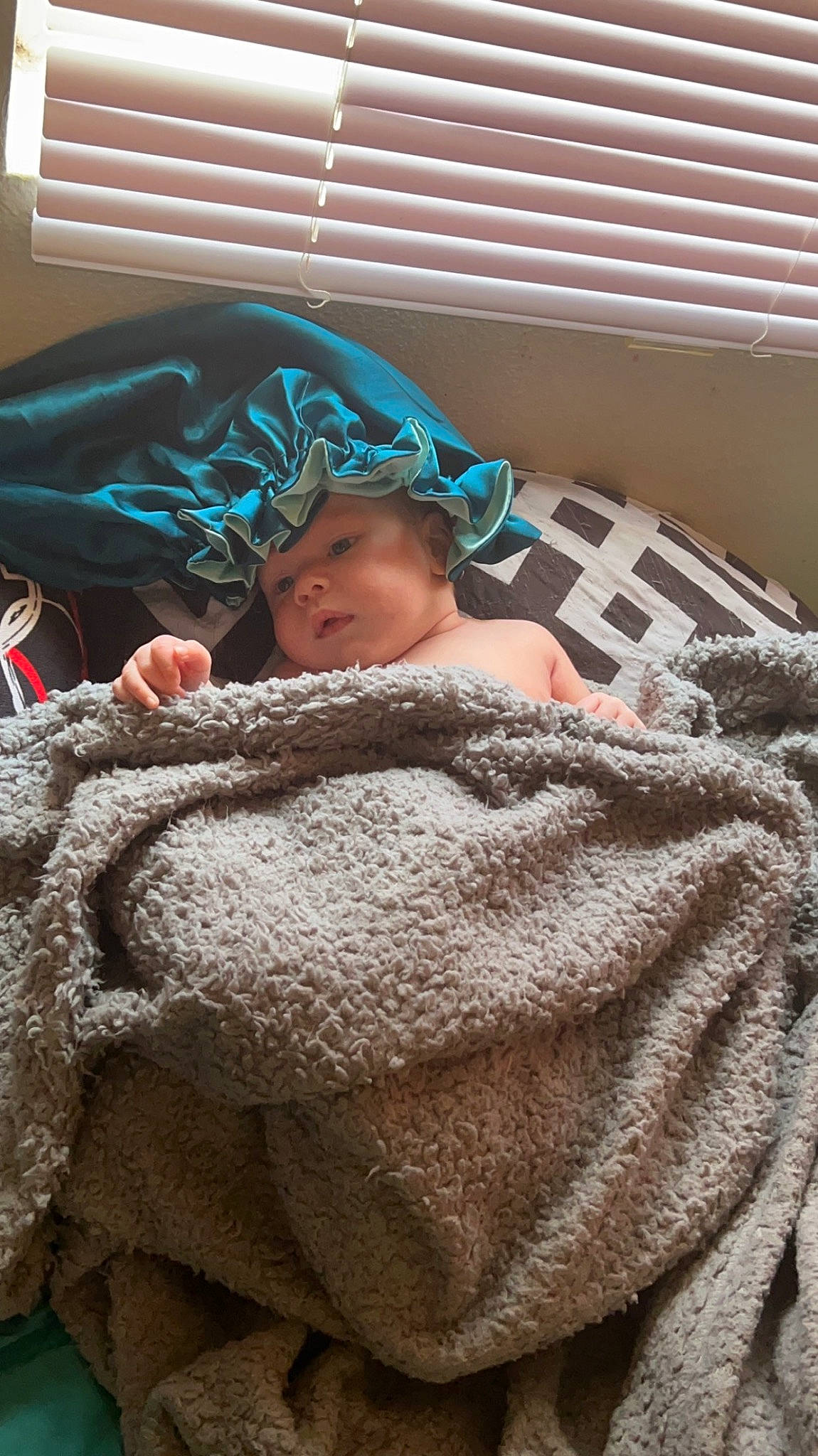 Paxton is registered to the contest to win money with this photo: baby, bed_sheet, bedding, bedtime, blanket, child, comfort, flooring, fur, headwear, linens, mammal, nap, pattern, person, room, sleep, textile, toddler, vertebrate