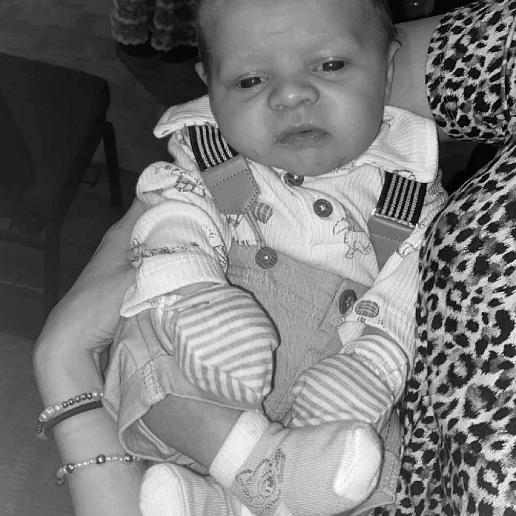 Jeremiah Ryder joined the competition — help win amazing prizes! baby, black_and_white, bracelet, chair, closeup, clothing, cute, expression, furniture, hand, holding, indoor, infant, leopard_print, monochrome, pattern, person, portrait, small, socks