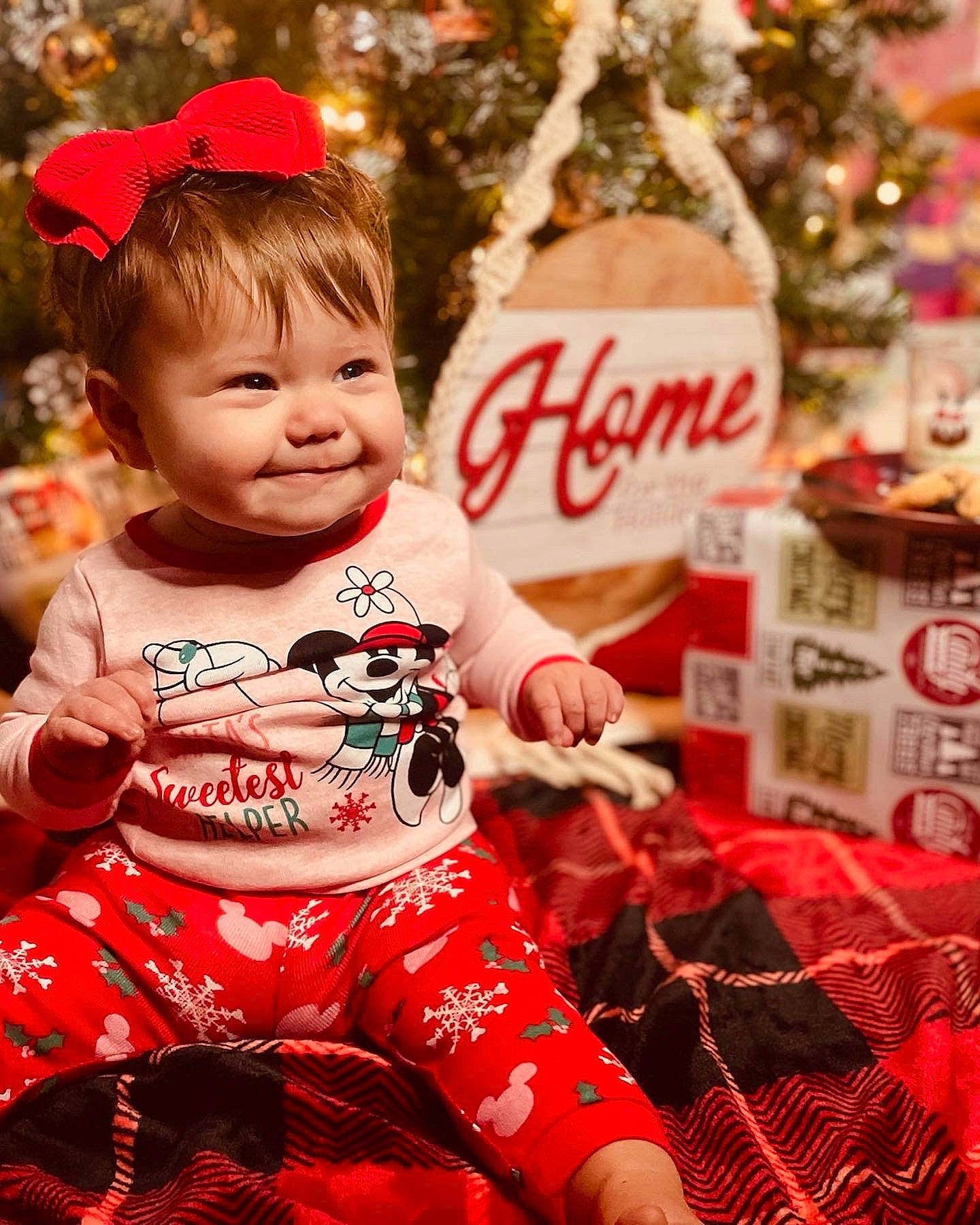 Meadow is registered to the contest to win money with this photo: baby, baby_toddler_clothing, child, christmas_tree, event, fun, happy, holiday, ornament, people_in_nature, person, pink, red, skin, sleeve, smile, snapshot, t_shirt, toddler, tradition