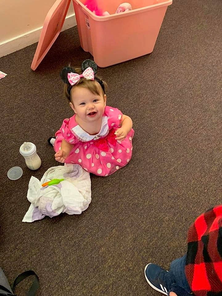 Meadow is registered to the contest to win money with this photo: baby, baby_products, baby_toddler_clothing, child, floor, flooring, fun, happy, human_leg, joy, magenta, person, photograph, pink, shoe, sitting, smile, snapshot, sneakers, toddler