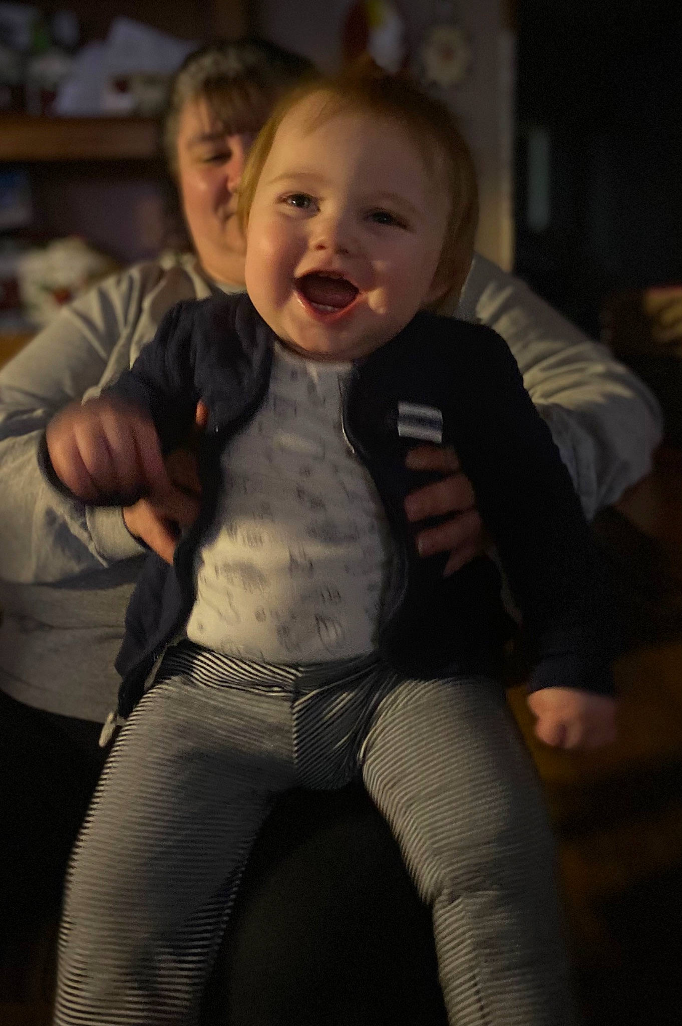 Aiden is registered to the contest to win money with this photo: baby, cheek, chest, comfort, event, flash_photography, formal_wear, fun, gesture, happy, head, iris, joint, person, shoulder, sleeve, smile, thigh, thumb, toddler