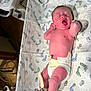 Jamison is registered to the contest to win money with this photo: newborn, baby, diaper, hospital, bassinet, footprints, monitoring_strap, infant, skin, lying_down, medical, cute, sleeping, hospital_room, child, person, healthcare, bed, blanket, resting