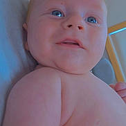 Jamison is registered to the contest to win money with this photo: baby, background, blue_eyes, cheeks, child, close_up, curious, expression, face, head, indoor, infant, mouth, nose, person, portrait, shoulder, skin, soft_light, young