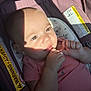 baby, infant, car_seat, child, face, hand, shadow, sunlight, pink_shirt, warning_label, seat, cute, skin, portrait, closeup, young_child, sitting, indoors, expression, small_hands