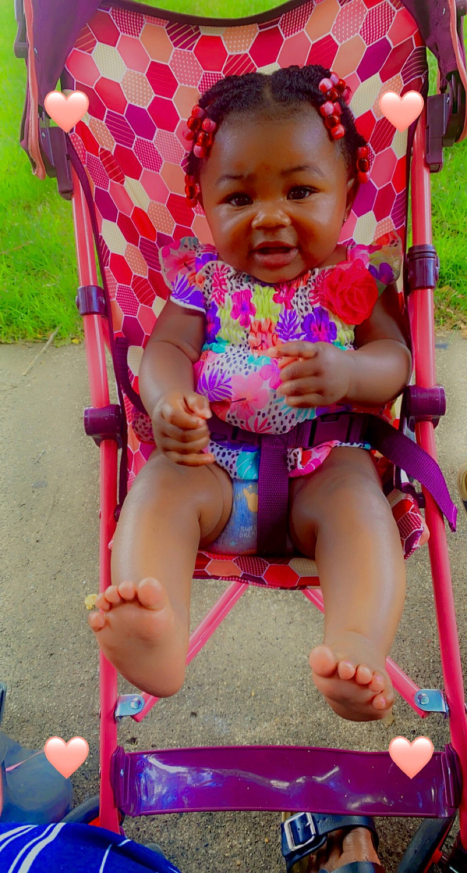 Jada is registered to the contest to win money with this photo: baby, baby_toddler_clothing, cheek, child, finger, fun, grass, green, happy, leisure, lip, magenta, people, person, photograph, pink, red, shorts, skin, smile
