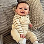 baby, child, clothing, couch, cozy, cute, happy, home, indoors, infant, overalls, person, pillows, portrait, seated, smiling, sock, soft, striped_shirt, texture