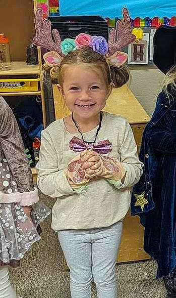 Haylie joined the competition — help win amazing prizes! bag, chair, child, costume, event, fashion_accessory, fashion_design, fun, hair, hairstyle, happy, joy, luggage_and_bags, pattern, person, pink, purple, room, sleeve, smile