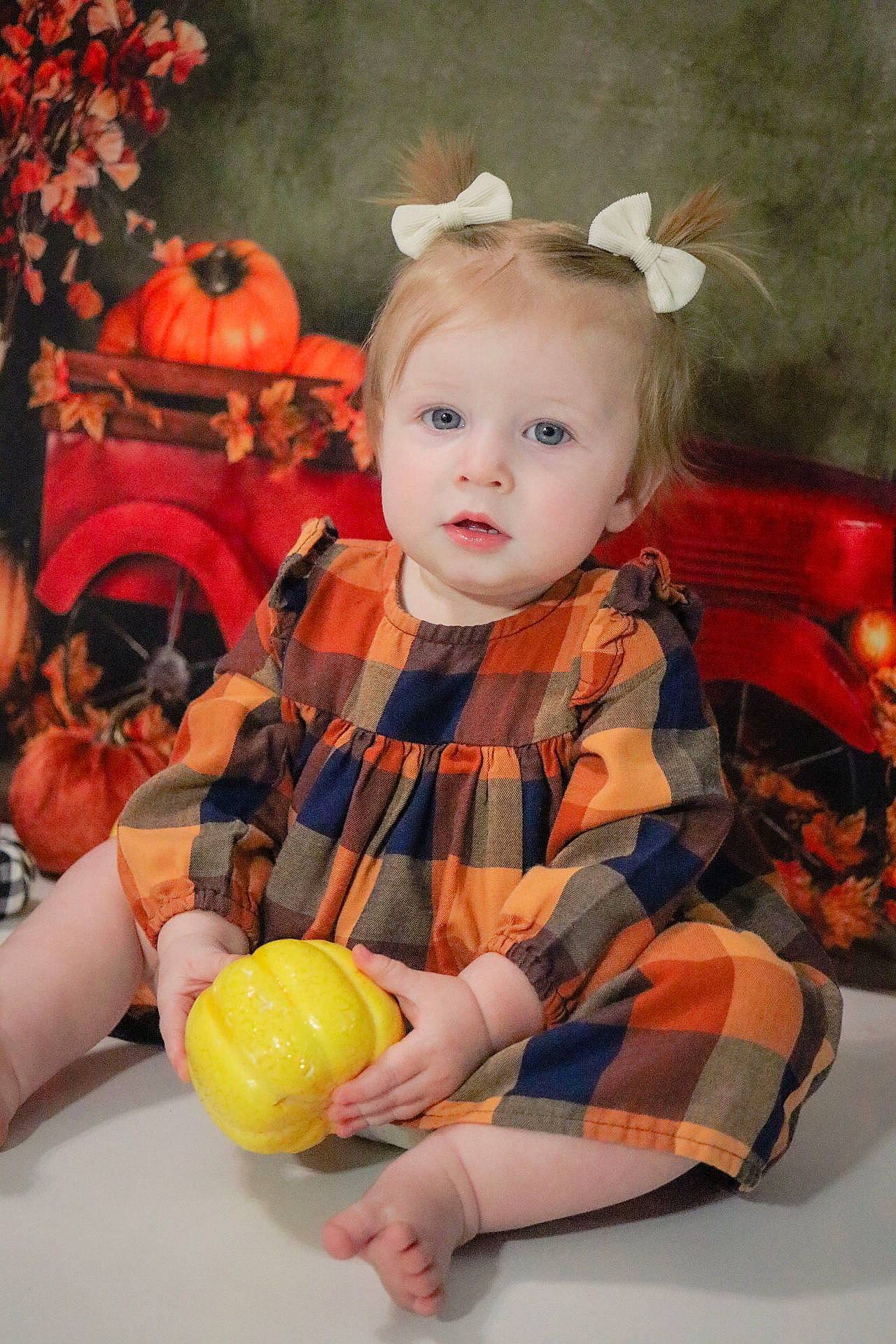 Whitley joined the competition — help win amazing prizes! baby, baby_toddler_clothing, beauty, calabaza, child, costume, dress, event, fashion_accessory, fun, happy, headband, orange, pattern, peach, person, personal_protective_equipment, pumpkin, room, sitting