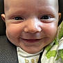 baby, smiling, face, close_up, car_seat, blanket, infant, happy, child, seatbelt, cute, portrait, clothing, human, young, toddler, skin, expression, head, comfort