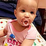baby, pacifier, pink_clothing, onesie, infant, cute, indoor, blanket, face, child, young, sitting, curious, soft_lighting, portrait, skin, earrings, expression, head, baby_shark